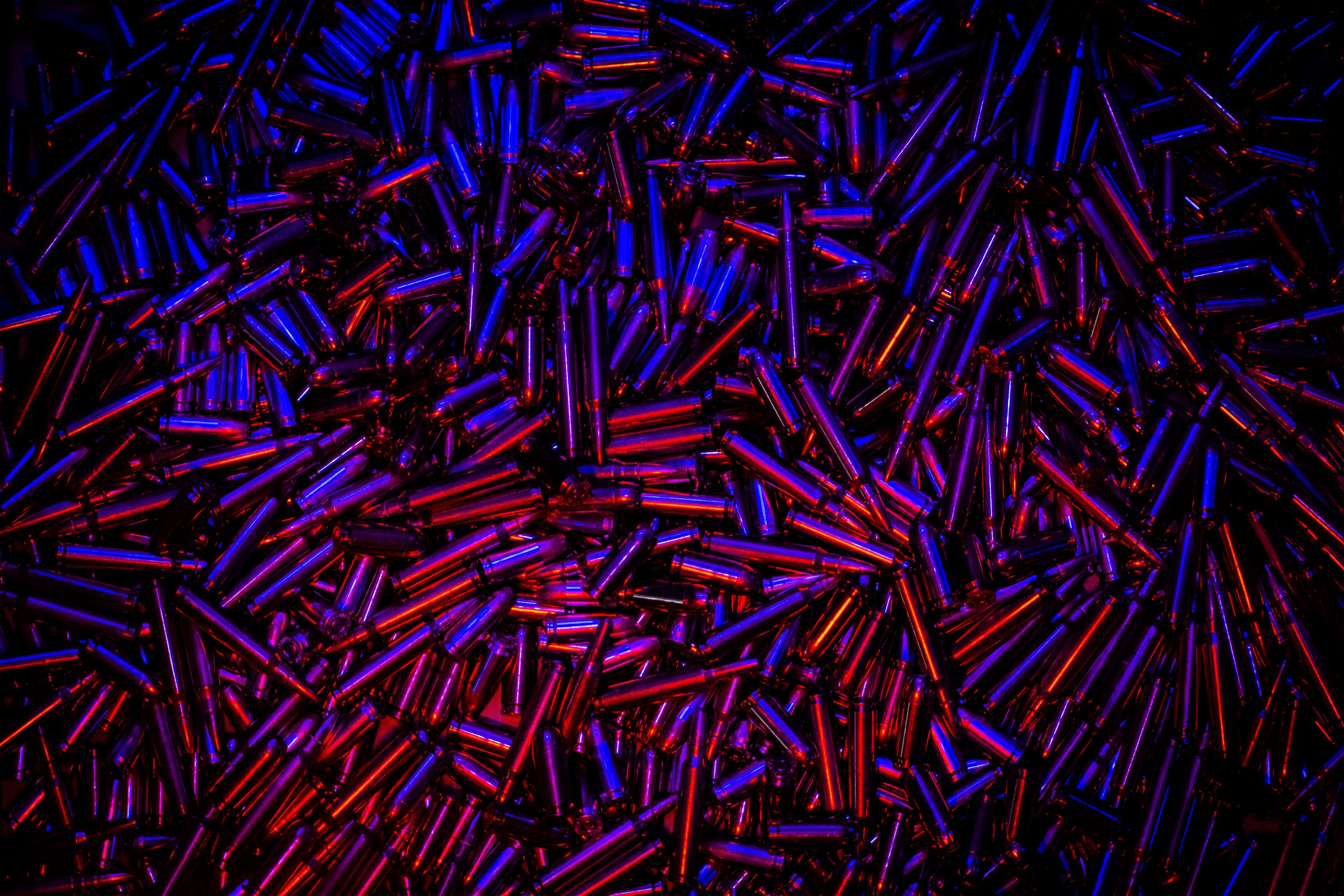 Patriotic hero image for Loaded Package featuring assorted bullets with red, white, and blue glow — symbolizing strength, freedom, and American firepower.