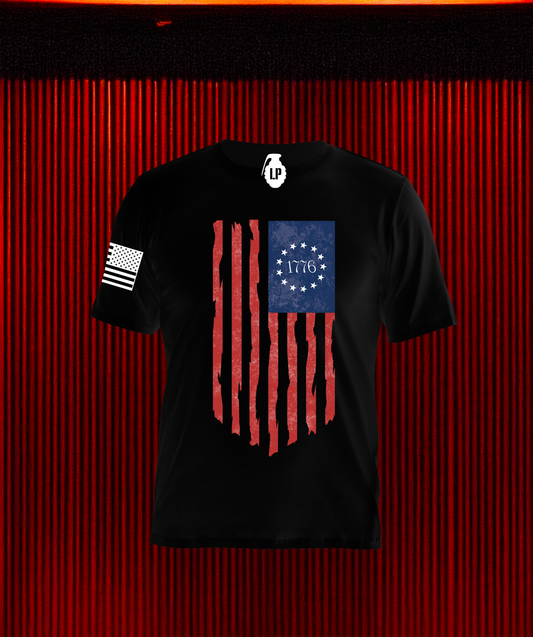 Back of Loaded Package tactical shirt featuring distressed 1776 Betsy Ross flag with 13 stars in a circle and 1776 in the center — patriotic design honoring American independence and freedom